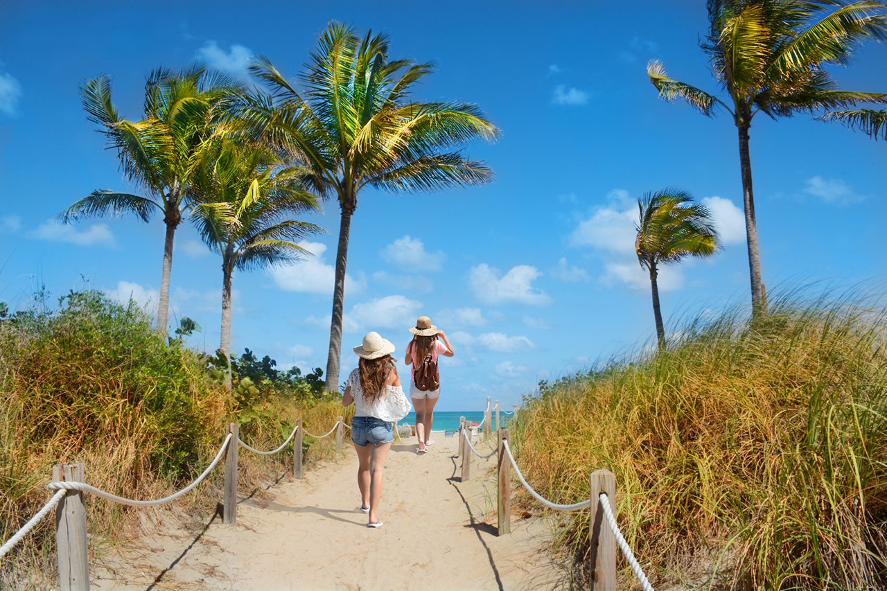 Girls walking to the beach in Miami, Florida, near The Flats at 15th.
